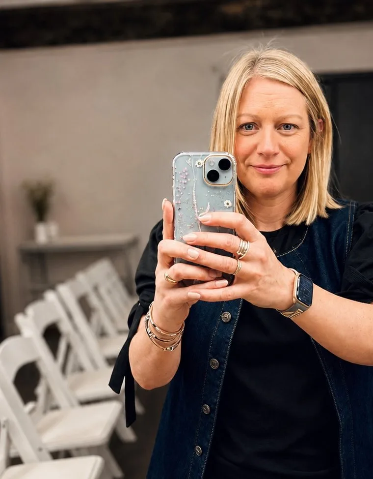 Natalie taking a photo on her phone